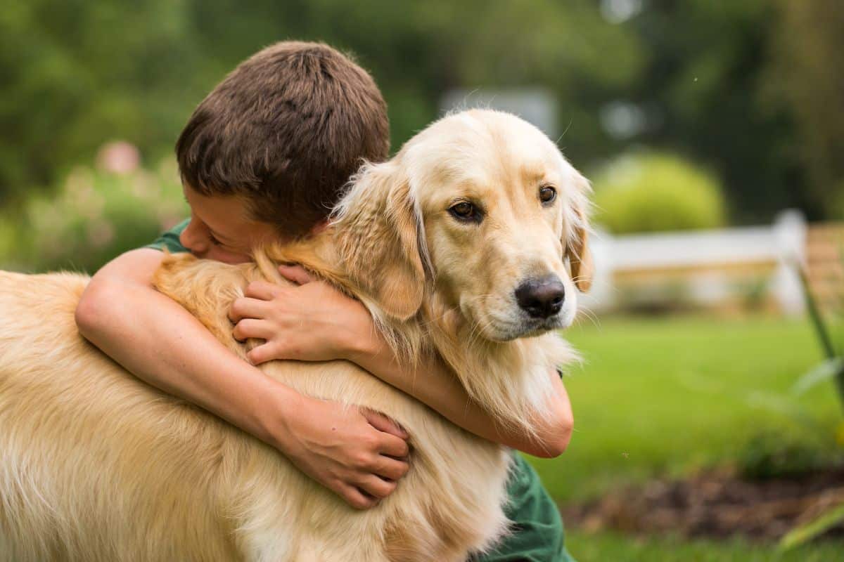 Fede hugging a happy dog
